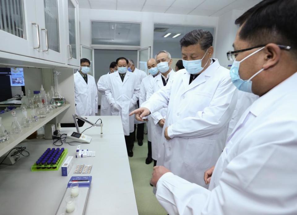 President Xi Jinping learns about progress on a vaccine at the Academy of Military Medical Sciences in Beijing, 2 March.
