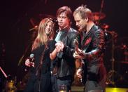 <p>Brad and Jennifer show off her engagement ring onstage at a Sting concert in November 1999 in New York City.  </p>