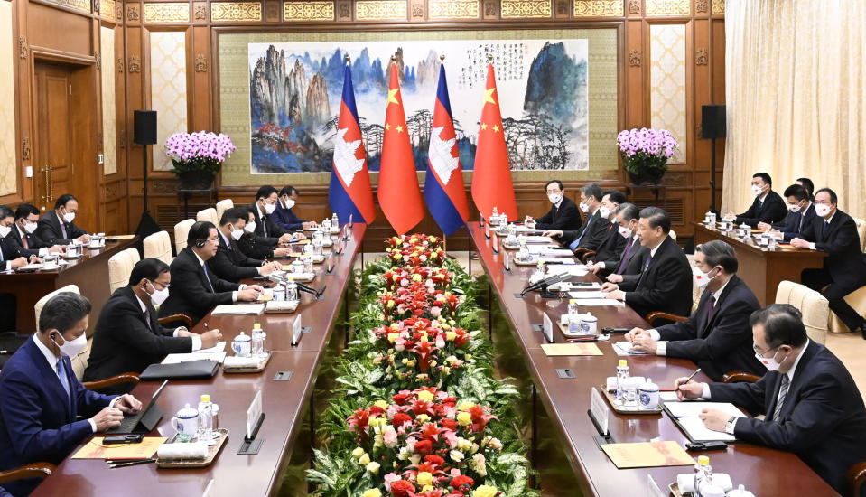 In this photo released by China's Xinhua News Agency, Cambodia's Prime Minister Hun Sen, third left, and Chinese President Xi Jinping, third right, meet at the Diaoyutai State Guesthouse in Beijing, Friday, Feb. 10, 2023. Hun Sen met Friday with Xi Jinping on a visit to his ally that underscores increasingly close ties between the two Asian countries. (Shen Hong/Xinhua via AP)