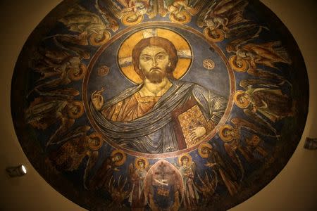 A painted part of an Orthodox Church dome depicting Christ, which was recovered by Cyprus after being stolen in the aftermath of Turkey's invasion in 1974, is seen in a Cypriot museum in Nicosia, Cyprus May 19, 2017. REUTERS/Yiannis Kourtoglou