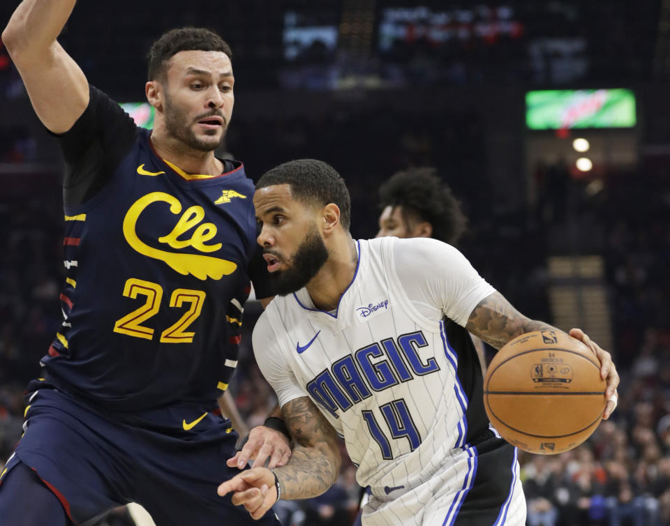 Orlando Magic's D.J. Augustin (14) drives past Cleveland Cavaliers' Larry Nance Jr. (22) in the first half of an NBA basketball game, Friday, Dec. 6, 2019, in Cleveland. Orlando won 93-87. (AP Photo/Tony Dejak)