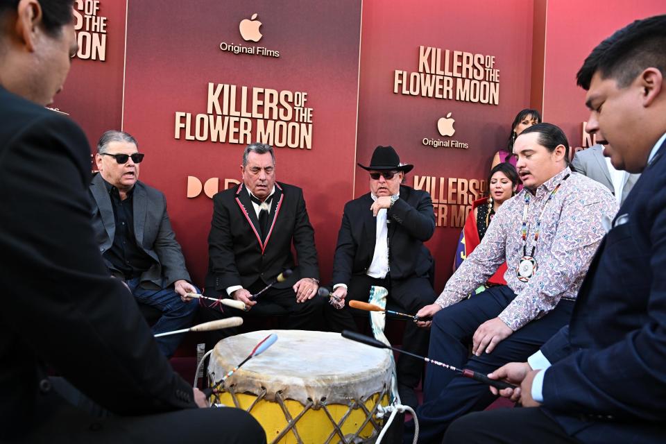 Members of the Osage Nation delegation, including Scott George, center, perform Oct. 16 at the Los Angeles premiere of Apple Original Films' "Killers of the Flower Moon" at Dolby Theatre. George, an Osage Nation singer and composer based in Del City, went on to earn an Oscar nomination for best original song for his work on the movie.