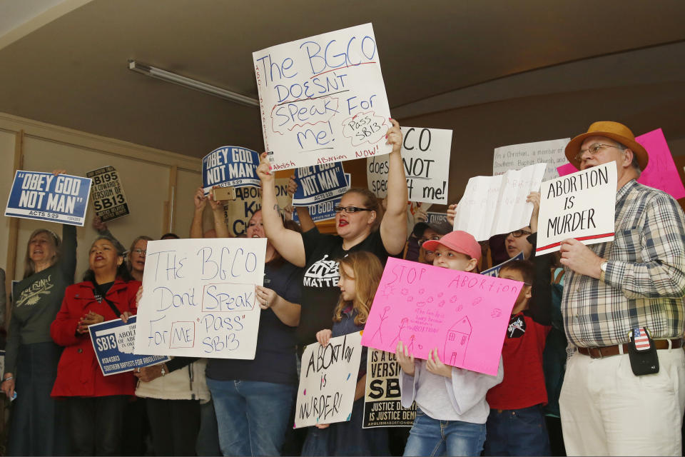 FILE - In this Monday, Feb. 25, 2019 file photo, abortion opponents cheer for a speaker at a rally at the state Capitol in Oklahoma City. An Oklahoma City abortion clinic filed a lawsuit Friday, Nov. 8, 2019, challenging longstanding state laws that allow only physicians to perform abortions in Oklahoma, marking the sixth time in the past five years that the state's abortion restrictions have ended up in court. The lawsuit, which was filed on behalf of the Trust Women clinic, contends that such laws are unconstitutional because they restrict women's access to abortion without any valid medical basis. (AP Photo/Sue Ogrocki, File)