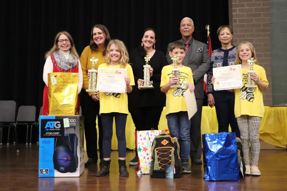 Taking top honors in the Mansfield-Richland County Third Grade Spelling bee were (front row from left): Evelyn Lee, first place; Kai Grassick, second place; and Margot Bibble, third place. The students' teacher (back row center) is Natasha Jolin.
