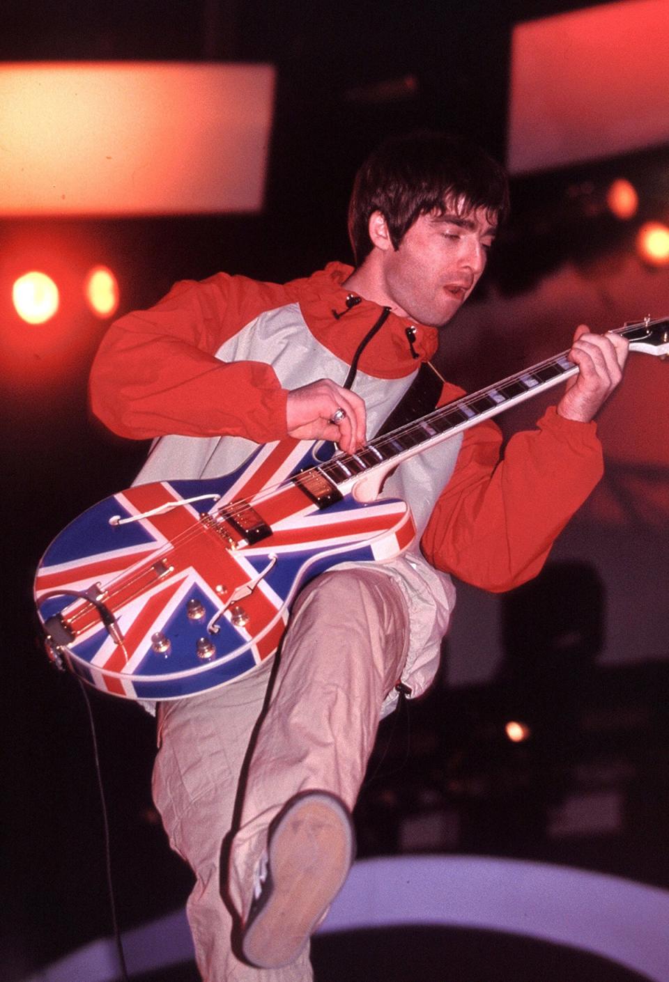 Noel Gallagher performs in Manchester in 1995 (Ilpo Musto/Shutterstock)