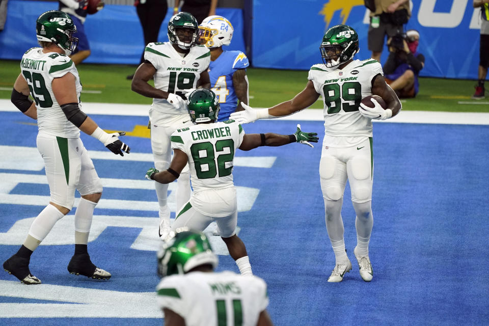 New York Jets tight end Chris Herndon (89) celebrates with teammates after making a touchdown catch against the Los Angeles Chargers during the second half of an NFL football game Sunday, Nov. 22, 2020, in Inglewood, Calif. (AP Photo/Jae C. Hong)