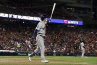 Houston Astros' Alex Bregman watches his grand slam against the Washington Nationals during the seventh inning of Game 4 of the baseball World Series Saturday, Oct. 26, 2019, in Washington. (AP Photo/Jeff Roberson)