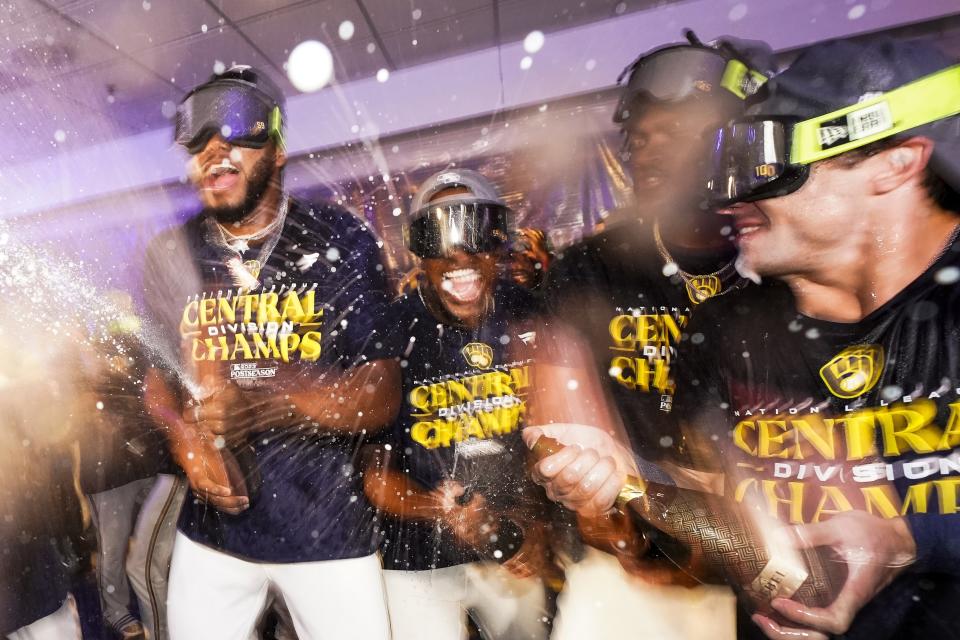 Milwaukee Brewers' players celebrate after clinching the National League Central Division after a baseball game against the St. Louis Cardinals Tuesday, Sept. 26, 2023, in Milwaukee. (AP Photo/Morry Gash)