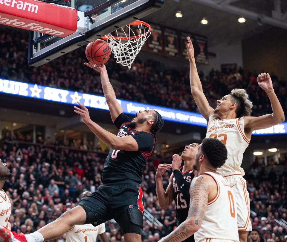 Texas Tech's Kevin Obanor (0) shoots a layup at the game on Tuesday, Feb. 1, 2022, at United Supermarkets Arena in Lubbock, Texas.