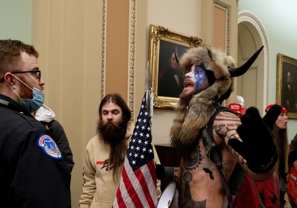 Qanon shaman viking riot capitol