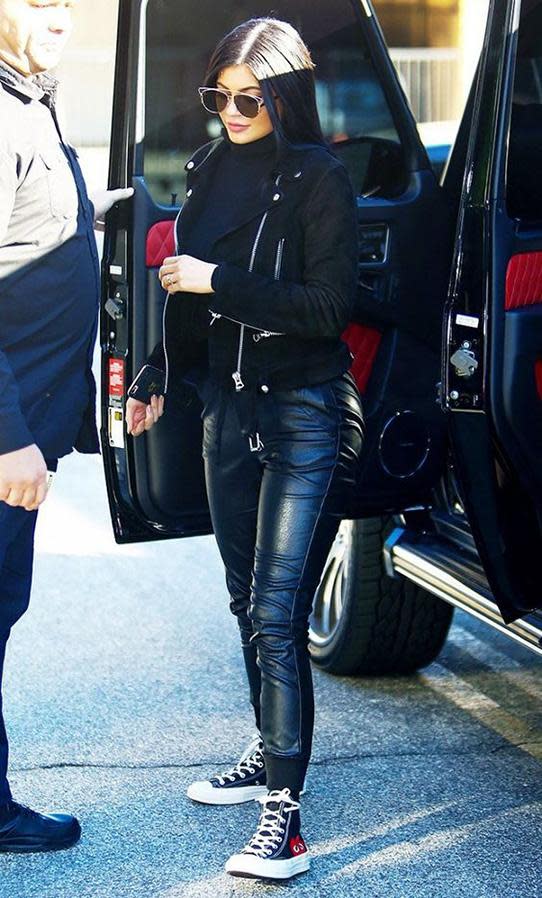 Kylie Jenner wearing Converse high tops.