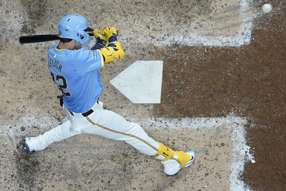 Milwaukee Brewers' Christian Yelich hits a double during the eighth inning of a baseball game against the Toronto Blue Jays Tuesday, June 11, 2024, in Milwaukee. (AP Photo/Morry Gash)