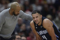 Orlando Magic head coach Jamahl Mosley, left, talks with Jalen Suggs (4) during the second half of an NBA basketball game against the Chicago Bulls, Friday, Nov. 18, 2022, in Chicago. (AP Photo/Paul Beaty)