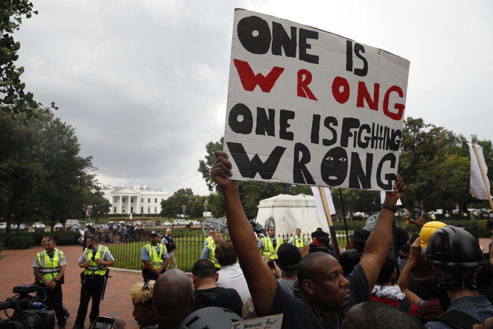 <p>Demonstrators march near the White House on the one year anniversary of the Charlottesville “Unite the Right” rally, Sunday, Aug. 12, 2018, in Washington. (Photo: Jacquelyn Martin/AP) </p>