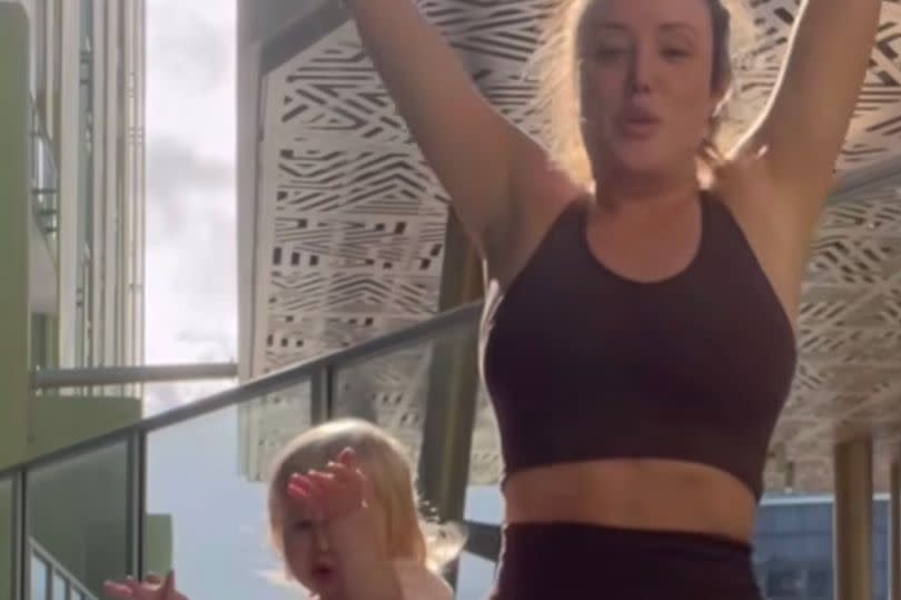 Charlotte does yoga with daughter Alba