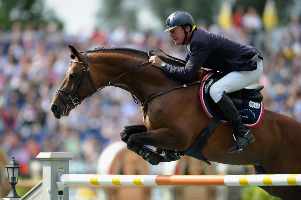 Thomas Voss of Germany and his horse Carinjo 9 compete in the Rolex Grand Prix jumping competition. (Photo by Dennis Grombkowski/Bongarts/Getty Images)