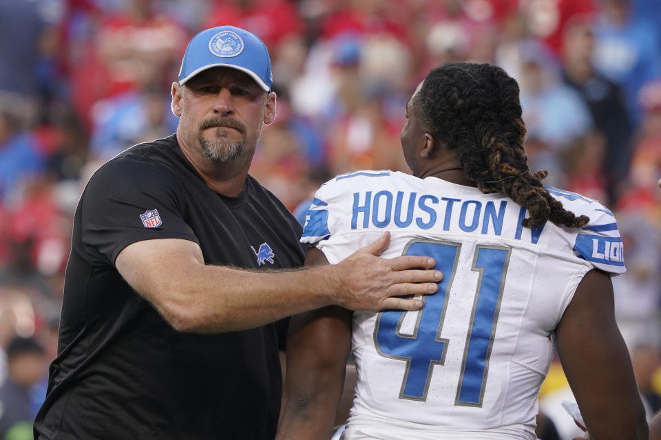 Detroit Lions head coach Dan Campbell greets linebacker James Houston (41) before the start of the season-opening game against the Chiefs. (AP Photo/Ed Zurga)