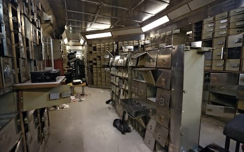 Smashed safe deposit boxes are pictured in the underground vault of the Hatton Garden Safe Deposit Company - Credit: Carl Court/Hatton Garden Properties Ltd via Getty Images