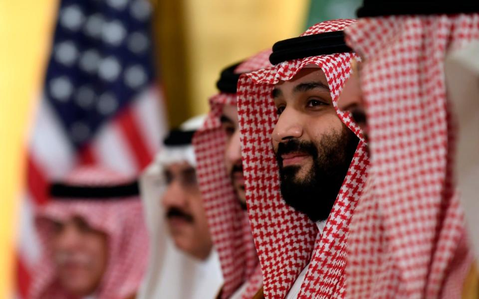 Saudi Arabia's Crown Prince Mohammad bin Salman listens during a meeting with President Donald Trump at the G20 - AP