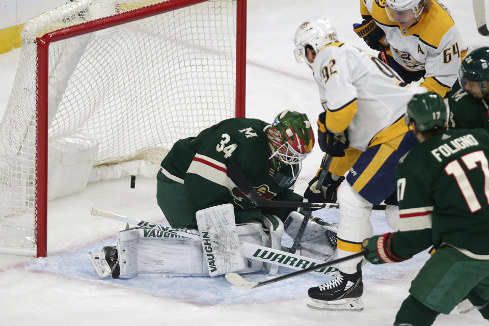 Nashville Predators center Ryan Johansen (92) scores a goal on Minnesota Wild goaltender Kaapo Kahkonen (34) in the first period of an NHL hockey game, Sunday, Oct. 24, 2021, in St. Paul, Minn. (AP Photo/Andy Clayton-King)