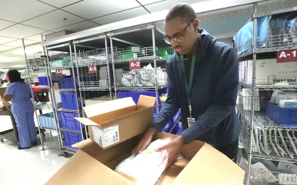 Project SEARCH student Malachi Boyer fills an order of supplies for the intensive medical center in the supply department, Thursday, Dec. 15, 2022, at Halifax Health Medical Center in Daytona Beach. Project SEARCH is a national program for students with disabilities who complete one-year internships to gain work experience and employability skills.