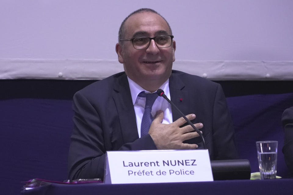 Paris police prefect Laurent Nunez reacts during a meeting with Parisians at a Paris town hall, Thursday, Feb.8, 2024. Officials spent more than two hours explaining the security, traffic and other arrangements that will be in place and took questions. Paris officials, Games organizers and government ministries are in the midst of concerted campaigns to explain to Parisians how the July 26-Aug.11 Summer Olympics and Paralympics that follow will impact their lives and how they can adapt. (AP Photo/John Leicester)