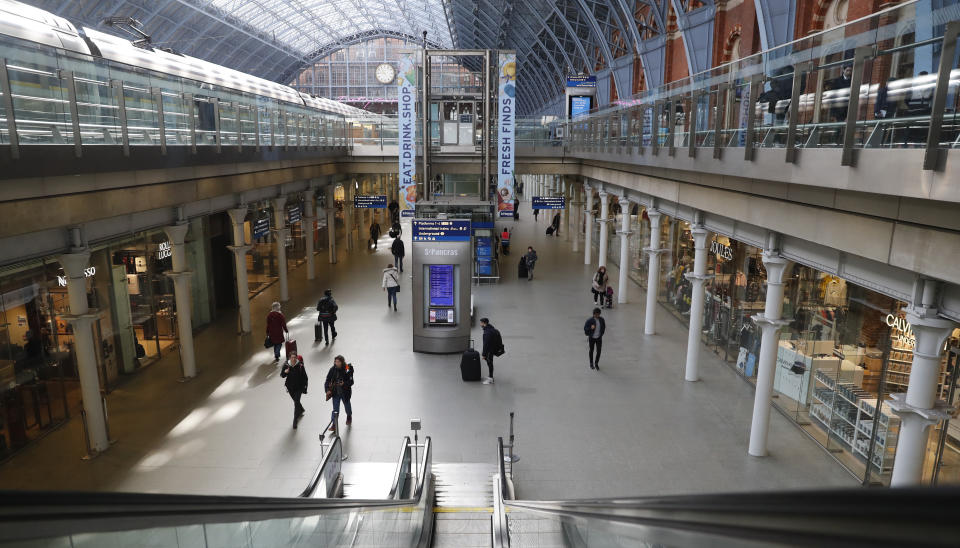 London's St Pancras railway station in London Monday, March 16, 2020. Eurostar services to Europe from London are still running, though they are no longer able to serve food on board and there are advisory signs about the Coronavirus at the entrance to the checkin . The vast majority of people recover from the new coronavirus. According to the World Health Organization, most people recover in about two to six weeks, depending on the severity of the illness. (AP Photo/Alastair Grant)