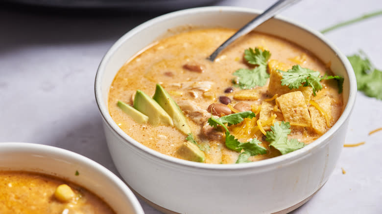 bowl of soup on table with spoon