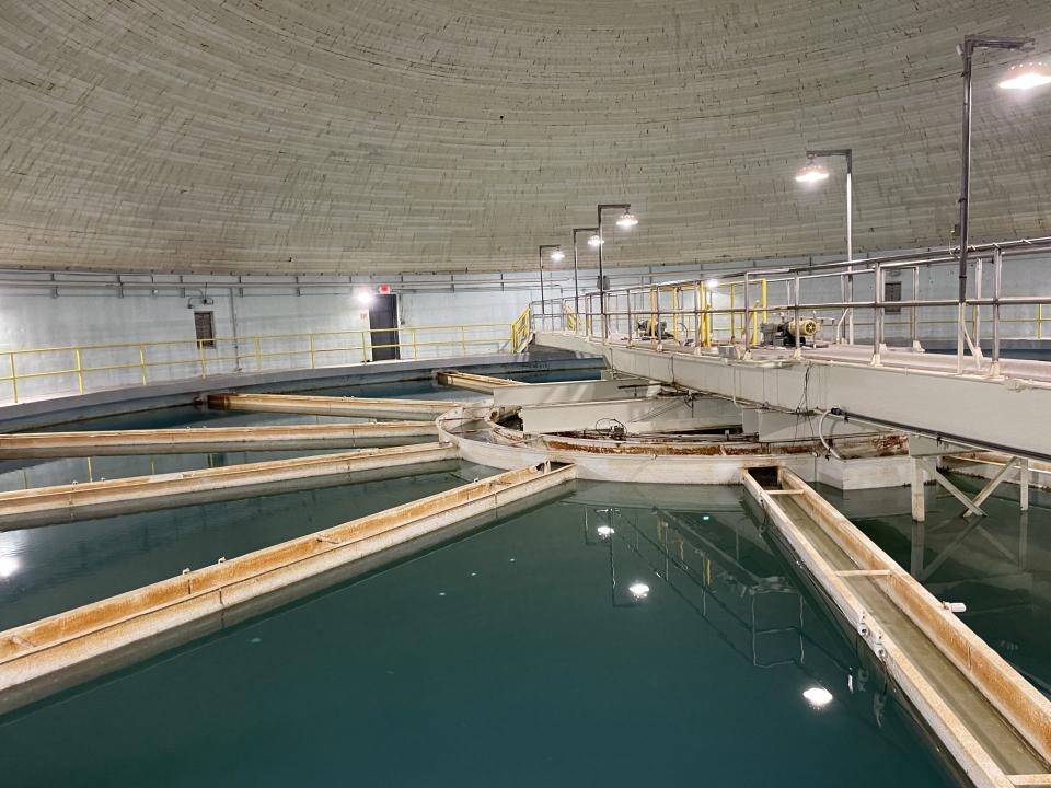 Monroe Water Treatment Plant's Clarifier 3, filled with water, is shown. It's in a building with a domed top. This clarifier can treat up to 10 million gallons a day.