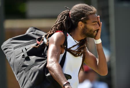 Tennis - Wimbledon - All England Lawn Tennis & Croquet Club, Wimbledon, England - 4/7/15 Men's Singles - Germany's Dustin Brown looks dejected after losing his third round match Mandatory Credit: Action Images / Tony O'Brien Livepic