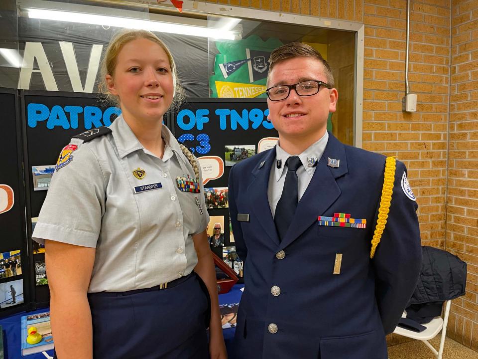 Cadets Sarah Standifer, 17, and Isaiah Collins, 18, take their turn at the AFJROTC display table at the fourth annual Community Bazaar at Karns High School Saturday, April 30, 2022.