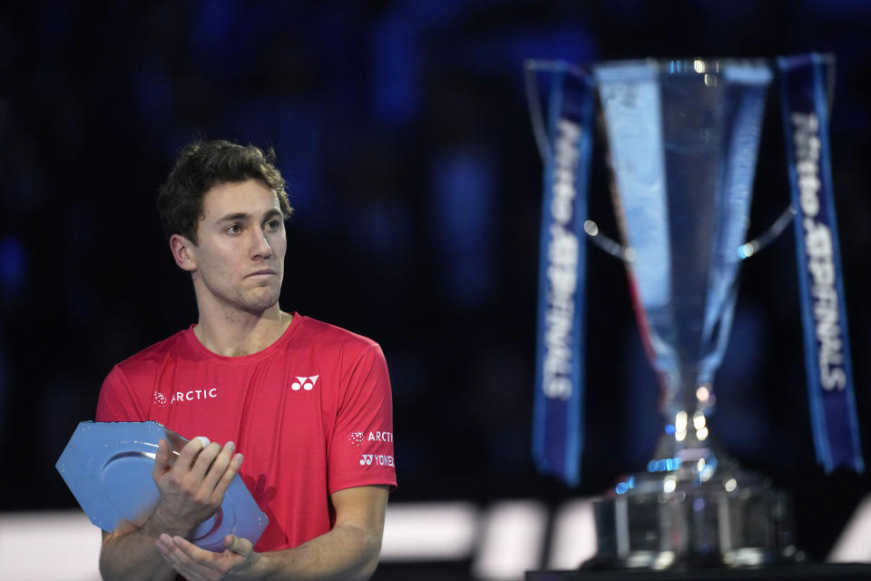 Norway's Casper Ruud holds his second lace trophy after losing 7-5, 6-3, to Serbia's Novak Djokovic in their singles final tennis match of the ATP World Tour Finals at the Pala Alpitour, in Turin, Italy, Sunday, Nov. 20, 2022. (AP Photo/Antonio Calanni)