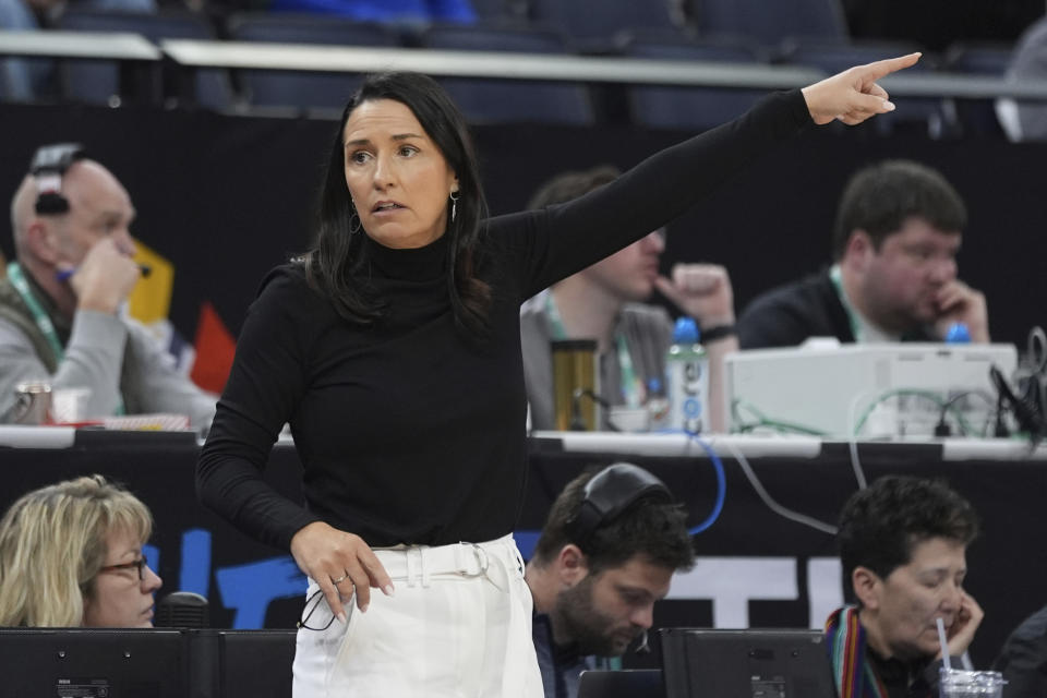 Nebraska head coach Amy Williams points during the second half of an NCAA college basketball game against Purdue at the Big Ten women's basketball tournament Thursday, March 7, 2024, in Minneapolis. (AP Photo/Abbie Parr)