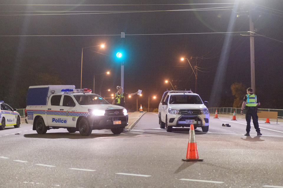 Police cordon off the intersection of Stuart Highway and McMinn Street where suspected gunman Ben Hoffmann was apprehended in Darwin, Tuesday, June 4, 2019.