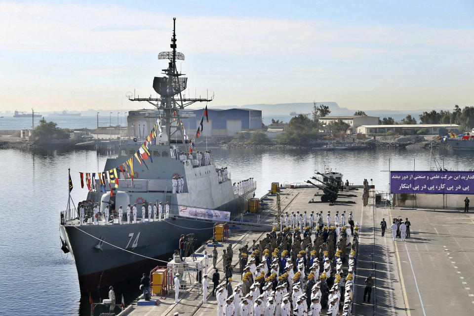 FILE - In this file photo provided Dec. 1, 2018, by the Iranian Army, Iranian naval forces attend an inauguration ceremony for the domestically built destroyer Sahand, in Bandar Abbas, Iran. Iran’s navy said Monday, Aug. 26, 2019, that it has deployed two warships, the Sahand and the Kharg, to the Gulf of Aden aimed at providing security to the country’s commercial shipping. The move comes amid a growing confrontation between Iran and the West. (Iranian Army via AP, File)