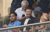 Former soccer star David Beckham talks to Bollywood actor Kira Adani as Akash Ambani watches during the ICC Men's Cricket World Cup first semifinal match between India and New Zealand in Mumbai, India, Wednesday, Nov. 15, 2023. (AP Photo/Rafiq Maqbool)