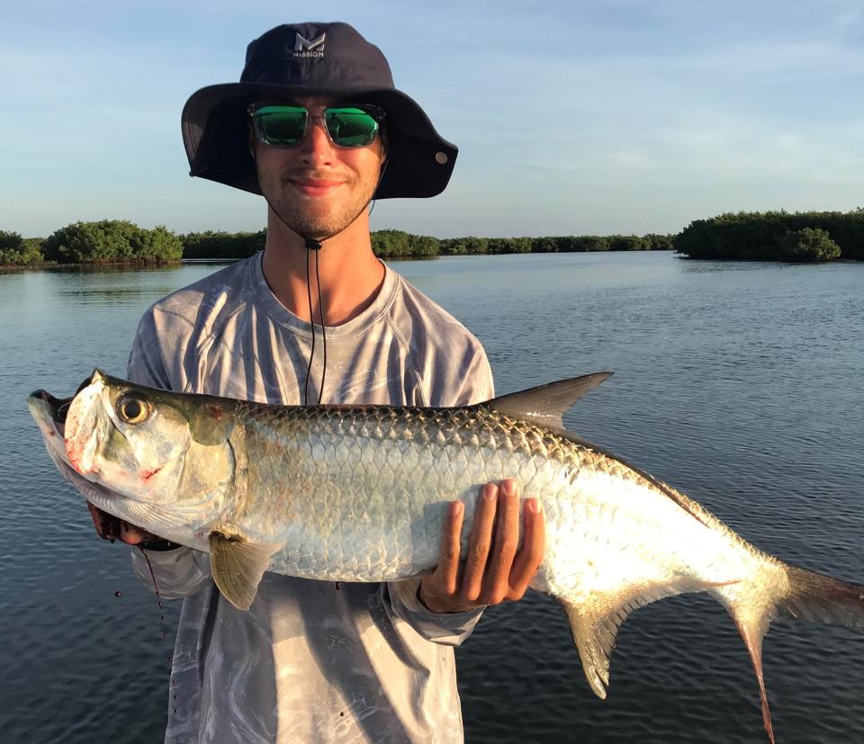 Capt. Michael Savedow sent along this picture of Nick Smith with a "teenaged" Tarpon he boated in the Edgewater backcountry.