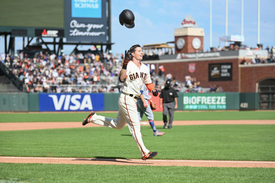 SAN FRANCISCO, CA - JULY 21: San Francisco Giants Outfield Mike Yastrzemski (5) tosses his helmet as he rounds the bases after his walk off solo home run during the MLB game between the New York Mets and the San Francisco Giants on July 21, 2019 at Oracle Park in San Francisco Ca. (Photo by Stephen Hopson/Icon Sportswire via Getty Images)