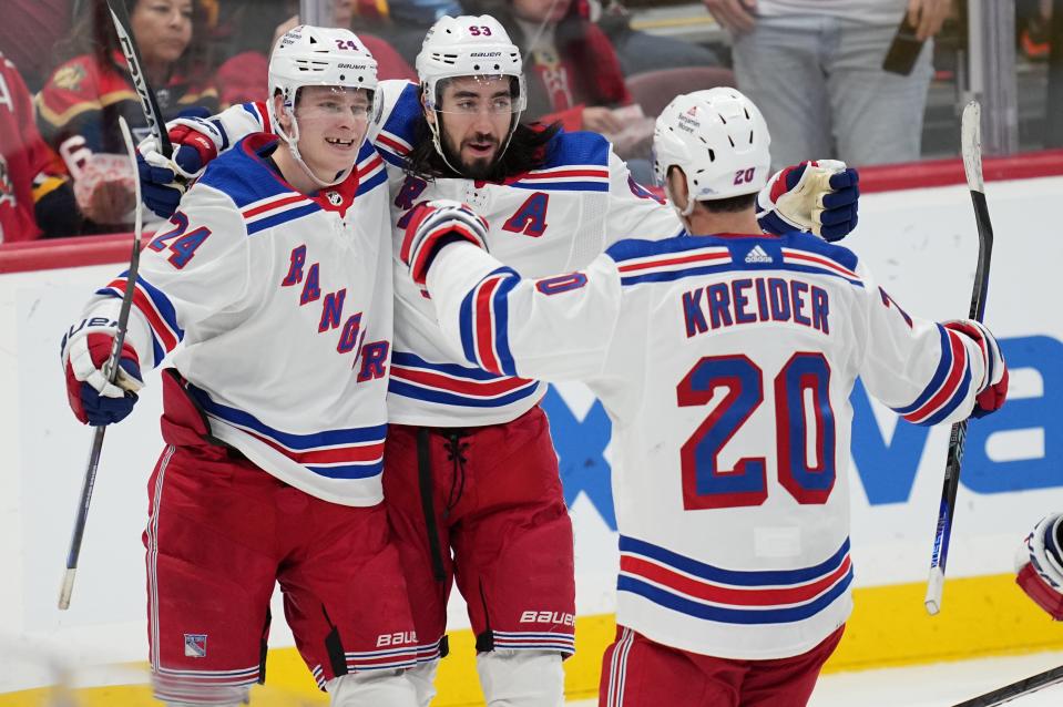 Jan 1, 2023; Sunrise, Florida, USA; New York Rangers left wing Chris Kreider (20) celebrates his goal during the second period against the Florida Panthers with center Mika Zibanejad (93) and right wing Kaapo Kakko (24) at FLA Live Arena.