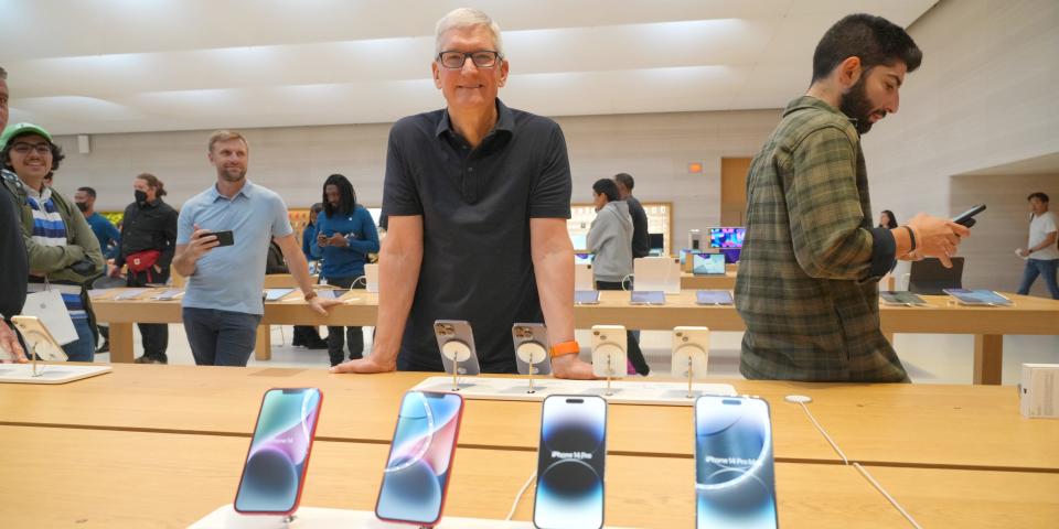 Tim Cook visits an Apple store in New York City on September 16.