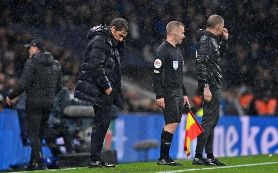 Antonio Conte stares at the ground on the touchline - AFP