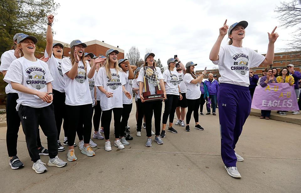 Ashland University's head coach Kari Pickens addresses the crowd gathered to greet the women's basketball team at Kates Gym as they got off the bus Monday, April 3, 2023. They were returning from Dallas after defeating Minnesota Duluth 78-67 in the NCAA Division II National Championship game on Saturday to finish the season undefeated 37-0 for the second time in program history. TOM E. PUSKAR/ASHLAND TIMES-GAZETTE