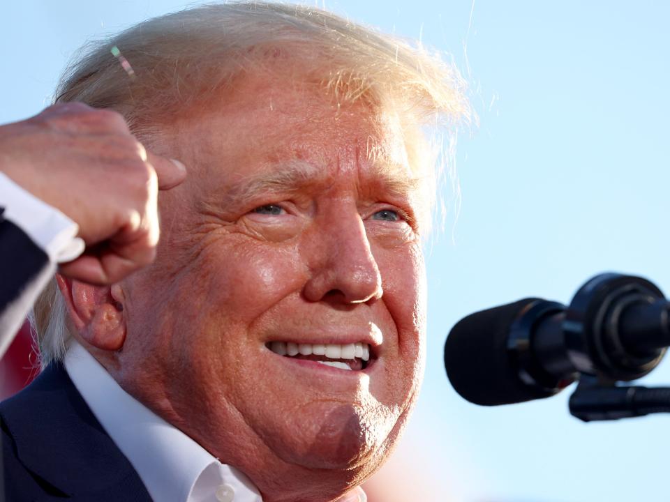 Former US President Donald Trump speaks at a campaign rally at Legacy Sports USA on October 9, 2022 in Mesa, Arizona. Trump was stumping for Arizona GOP candidates, including gubernatorial nominee Kari Lake, ahead of the midterm election on November 8.