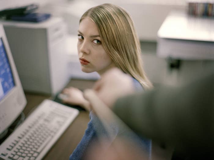 woman at her computer looking annoyed