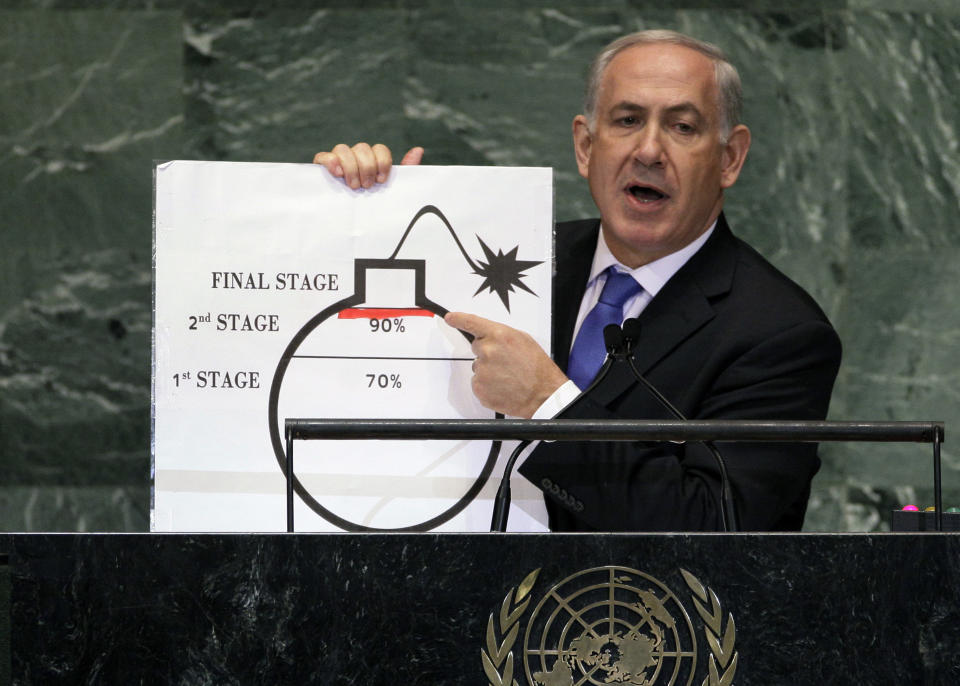 FILE - In this Sept. 27, 2012 file photo, Israeli Prime Minister Benjamin Netanyahu shows an illustration as he describes his concerns over Iran's nuclear ambitions during his address to the 67th session of the United Nations General Assembly at U.N. headquarters. Netanyahu has been a vocal critic of Iran over the years, accusing the Islamic Republic of sinister intentions at every opportunity. But the outspoken Israel leader has remained uncharacteristically quiet throughout the current crisis between the U.S. and Iran. (AP Photo/Richard Drew, File)