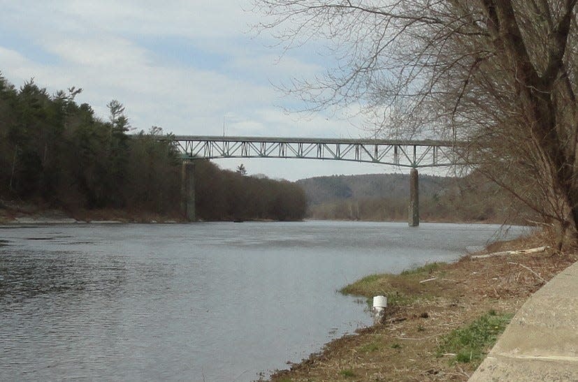 The Milford-Montague (Route 206) Toll Bridge spans the Delaware River, accessed on the Pennsylvania side from Route 209 just south of Milford Borough, Pike County. The bridge is pictured in the background, looking south from Milford Beach, part of the Delaware Water Gap National Recreation Area. Sussex County, New Jersey is on the left.
