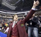 Will Ferrell as Ron Burgundy salutes the crowd at the Roar of the Rings Canadian Olympic Curling Trials in Winnipeg, Manitoba December 1, 2013. REUTERS/Trevor Hagan (CANADA - Tags: SPORT ENTERTAINMENT CURLING)