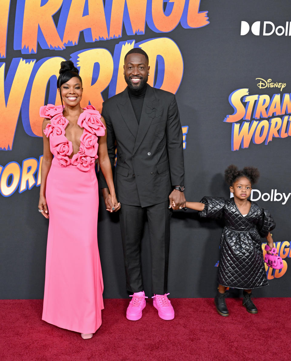 LOS ANGELES, CALIFORNIA - NOVEMBER 15: (L-R) Gabrielle Union, Dwyane Wade, and Kaavia James Union Wade attend Disney's "Strange World" Premiere at El Capitan Theatre on November 15, 2022 in Los Angeles, California. (Photo by Axelle/Bauer-Griffin/FilmMagic)