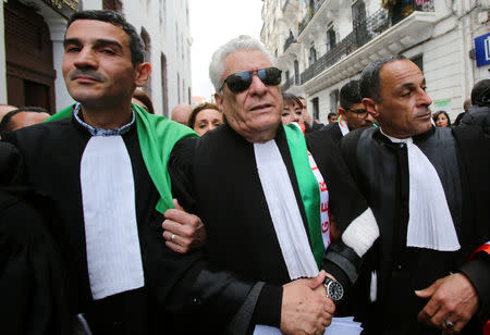 Mustapha Bouchachi, a rights activist and lawyer, marches with others during a protest to demand the immediate resignation of President Abdelaziz Bouteflika, in Algiers, Algeria March 23, 2019. REUTERS/Ramzi Boudina