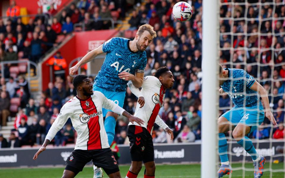 Tottenham's Harry Kane, top, scores his side's second goal during the English Premier League soccer match - AP/David Cliff